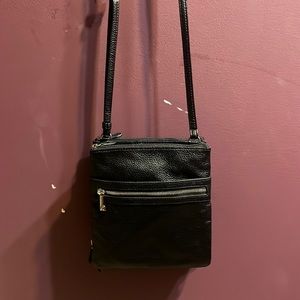 Black over the shoulder purse. 8 different compartments.